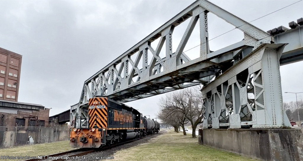 WE 7008 crosses under the abandoned A&BB RR bridge.